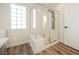 Bathroom featuring glass shower, sleek fixtures, and stylish tile at 4336 Fenton Ln, North Las Vegas, NV 89032