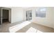 Bedroom with carpet, sliding glass door, and plenty of natural light at 4336 Fenton Ln, North Las Vegas, NV 89032