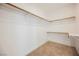 Walk-in closet with two levels of wooden hanging bars at 4336 Fenton Ln, North Las Vegas, NV 89032