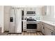 Modern kitchen with stainless steel appliances, sleek countertops, and neutral cabinetry at 4336 Fenton Ln, North Las Vegas, NV 89032