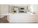 Modern kitchen with stainless steel appliances, white countertop, and gray cabinetry at 4336 Fenton Ln, North Las Vegas, NV 89032