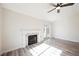 Bright living room with fireplace, wood floors, and sliding glass doors to the backyard at 4336 Fenton Ln, North Las Vegas, NV 89032