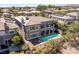 Aerial view of the home showcasing a pool, well-manicured yard, and beautiful neighborhood at 437 Pinnacle Heights Ln, Las Vegas, NV 89144