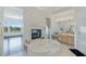 Elegant bathroom featuring a fireplace, large tub, and vanity with modern fixtures at 437 Pinnacle Heights Ln, Las Vegas, NV 89144