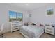 Cozy bedroom with large window, mirrored dresser, and comfortable bed, creating a serene atmosphere at 437 Pinnacle Heights Ln, Las Vegas, NV 89144