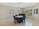 Elegant dining area with stylish table, chairs, and contemporary lighting at 437 Pinnacle Heights Ln, Las Vegas, NV 89144