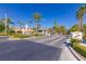 Community entrance with gatehouse surrounded by manicured landscaping at 437 Pinnacle Heights Ln, Las Vegas, NV 89144