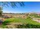 Scenic view of a golf course with mountain backdrop, perfect for golf enthusiasts at 437 Pinnacle Heights Ln, Las Vegas, NV 89144