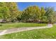 Lush green lawn with mature trees, creating a serene environment at 437 Pinnacle Heights Ln, Las Vegas, NV 89144