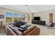 Inviting living room featuring large windows, a modern chandelier, and plush seating at 437 Pinnacle Heights Ln, Las Vegas, NV 89144