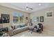Cozy living room with large window, comfortable seating, and contemporary decor at 437 Pinnacle Heights Ln, Las Vegas, NV 89144