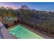 Inviting pool with steps and lush landscaping, perfect for relaxation at 437 Pinnacle Heights Ln, Las Vegas, NV 89144