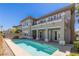 Beautiful rear exterior featuring a swimming pool, balcony, and covered patio with access to the home at 437 Pinnacle Heights Ln, Las Vegas, NV 89144