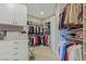 Spacious walk-in closet features custom shelving and storage for optimal organization of clothing and accessories at 437 Pinnacle Heights Ln, Las Vegas, NV 89144