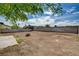 Expansive backyard space with clear skies and mature trees and greenery at 4387 Sun Vista Dr, Las Vegas, NV 89104