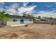 Exterior view of the home highlighting the backyard, patio, and block fencing at 4387 Sun Vista Dr, Las Vegas, NV 89104