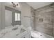 This bathroom features a marble vanity and a walk-in shower with grey tiling at 4387 Sun Vista Dr, Las Vegas, NV 89104
