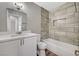 Bathroom featuring modern fixtures, a tiled shower, and a marble countertop vanity at 4387 Sun Vista Dr, Las Vegas, NV 89104