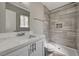 This bathroom features a marble vanity and a walk-in shower with grey tiling at 4387 Sun Vista Dr, Las Vegas, NV 89104