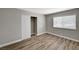 This bedroom features wood floors, a closet with sliding doors, and a window at 4387 Sun Vista Dr, Las Vegas, NV 89104