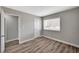This bedroom features hardwood floors, base molding, neutral paint, and natural light at 4387 Sun Vista Dr, Las Vegas, NV 89104