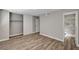 This bedroom features wood floors, a closet, and an ensuite bathroom at 4387 Sun Vista Dr, Las Vegas, NV 89104