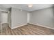 This bedroom features wood floors, neutral paint, and two entryways at 4387 Sun Vista Dr, Las Vegas, NV 89104