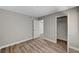 This bedroom features hardwood floors, base molding, neutral paint, a closet and natural light at 4387 Sun Vista Dr, Las Vegas, NV 89104