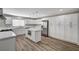 Modern kitchen featuring white cabinets, quartz countertops, stainless steel appliances, and an island at 4387 Sun Vista Dr, Las Vegas, NV 89104