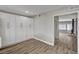 Bright open kitchen area with new cabinets, wood floors, and a view of a fireplace at 4387 Sun Vista Dr, Las Vegas, NV 89104