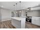 Well-equipped kitchen showcases a central island, modern lighting, and stainless-steel appliances at 4387 Sun Vista Dr, Las Vegas, NV 89104