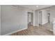 Spacious open living area featuring wood floors, neutral walls, and seamless transitions at 4387 Sun Vista Dr, Las Vegas, NV 89104