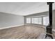 Open living room with lots of natural light, wood-look floors and a decorative fireplace at 4387 Sun Vista Dr, Las Vegas, NV 89104