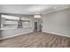 Bright living area with wood floors and open view of the updated kitchen, complete with a breakfast bar at 4387 Sun Vista Dr, Las Vegas, NV 89104