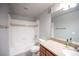 Standard bathroom with combination tub and shower, neutral tile, and vanity with light countertop at 4400 S Jones Blvd # 2075, Las Vegas, NV 89103