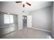 Bedroom featuring wood-look floors, ceiling fan, and a large closet with mirror sliding doors at 4400 S Jones Blvd # 2075, Las Vegas, NV 89103