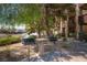 Community area featuring multiple grills and a table under a shady tree at 4400 S Jones Blvd # 2075, Las Vegas, NV 89103