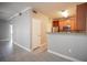 The bright kitchen is equipped with stainless steel appliances and wood cabinets, with an adjacent living space at 4400 S Jones Blvd # 2075, Las Vegas, NV 89103