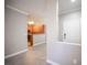 Spacious living room provides an open layout with a view of the kitchen featuring stainless steel appliances at 4400 S Jones Blvd # 2075, Las Vegas, NV 89103