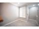 A bright living room offers a view of the kitchen with stainless steel appliances and wood cabinets at 4400 S Jones Blvd # 2075, Las Vegas, NV 89103