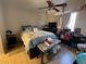Cozy bedroom with a ceiling fan, comfortable bed, side table, and bright natural light at 4568 Little Finch Ln, Las Vegas, NV 89115