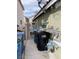 Functional side yard with trash bins and secured gate, offering practical outdoor space at 4568 Little Finch Ln, Las Vegas, NV 89115