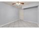 Empty room showcasing light-colored walls, tile floors, and a ceiling fan at 4644 Canna Dr, Las Vegas, NV 89122