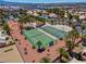 Aerial shot of community tennis and basketball courts surrounded by mature palms at 4644 Canna Dr, Las Vegas, NV 89122