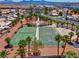 Aerial shot of community tennis and basketball courts surrounded by mature palms at 4644 Canna Dr, Las Vegas, NV 89122