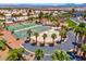 Aerial shot of community tennis and basketball courts surrounded by mature palms at 4644 Canna Dr, Las Vegas, NV 89122