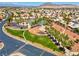 Aerial view of a community park with playground and recreation surrounded by palms at 4644 Canna Dr, Las Vegas, NV 89122