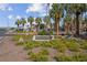 Landscaped community entrance sign for Palm Gardens with mature palm trees at 4644 Canna Dr, Las Vegas, NV 89122