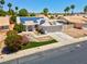 Charming single-Gathering home featuring solar panels, desert landscaping, and a two-car garage at 4644 Canna Dr, Las Vegas, NV 89122
