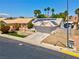 Charming single-Gathering home featuring solar panels, desert landscaping, and a two-car garage at 4644 Canna Dr, Las Vegas, NV 89122